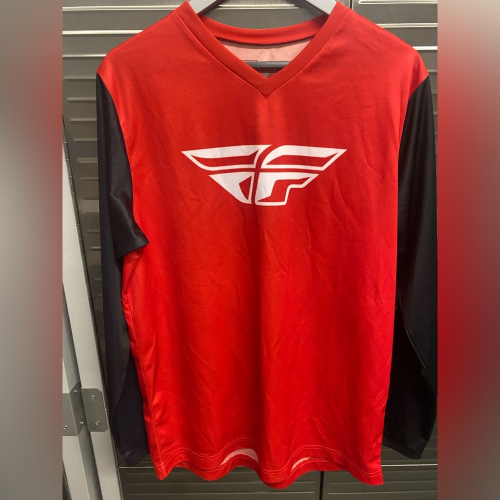 Men’s motocross riding gear shirt is size small , pants are size 30
